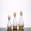 Wholesales high-grade Bowling shape Gradient golden cosmetics electroplating glass bottle/jars with good price